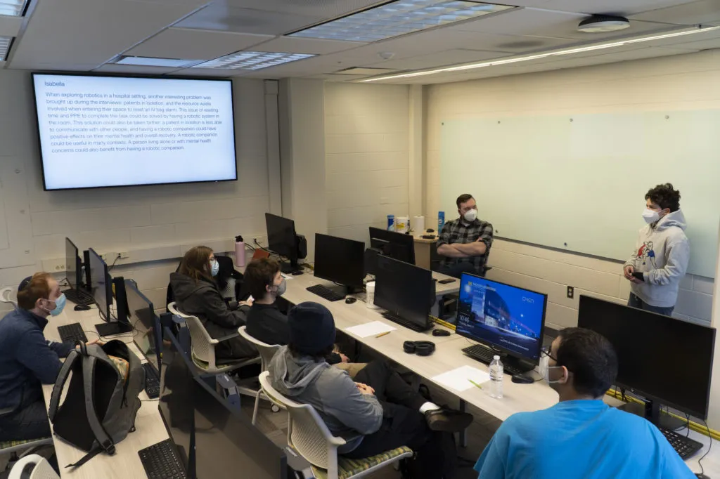 Student gives presentation on healthcare companion robot in ROB 204