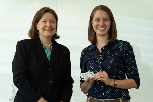 Professor Dawn Tilbury presents Meghan Dailey with a gift.