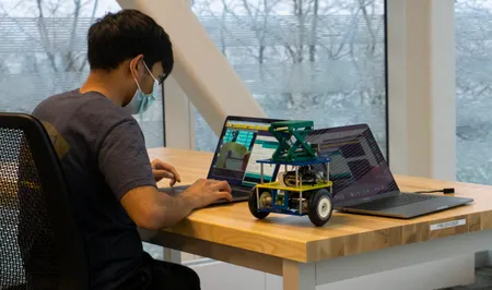 A student works on robot in ROB 103