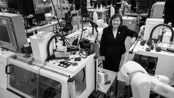Dawn Tilbury poses in the robotics lab.