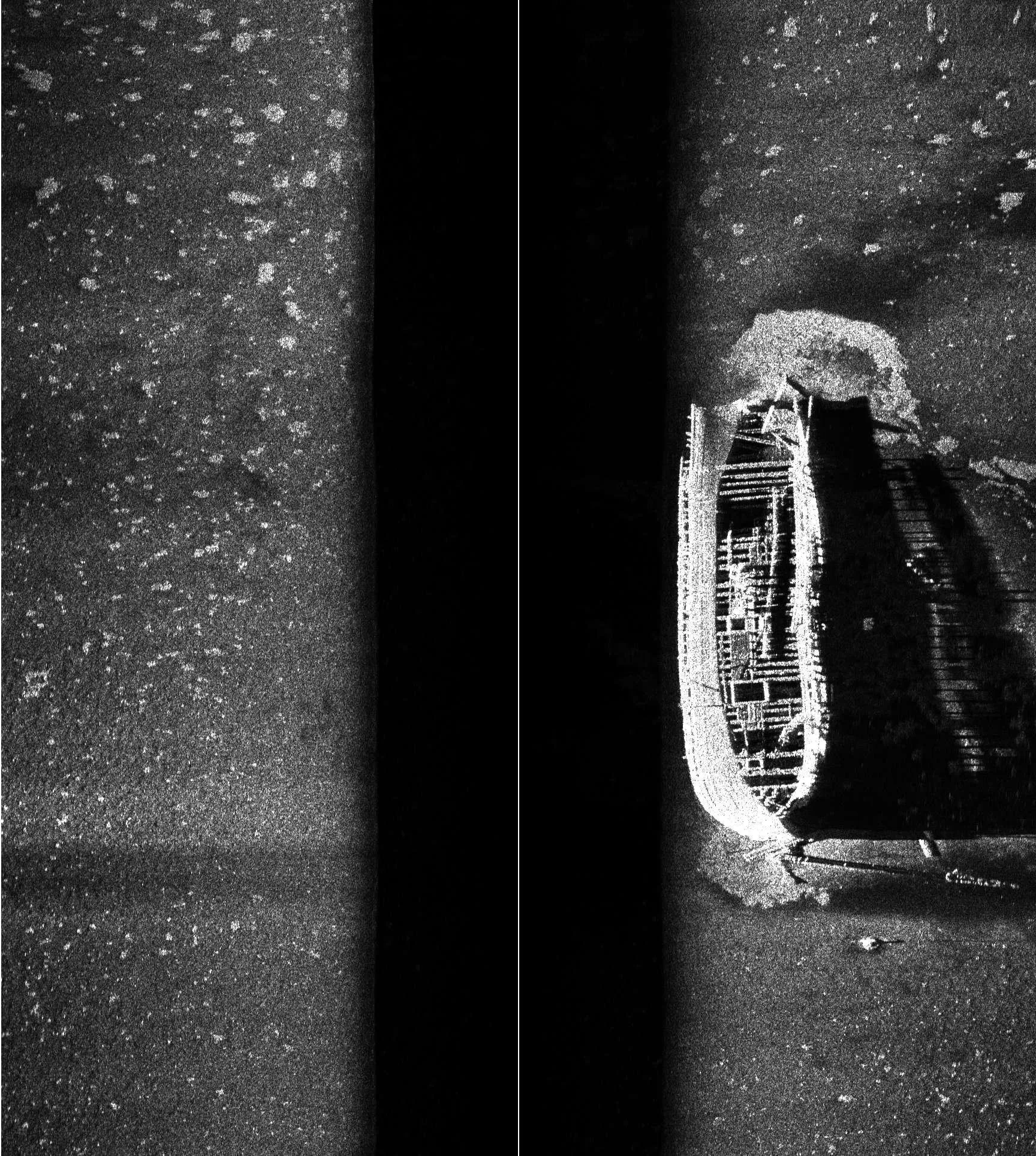 A black and white sonar image of a sunken ship.