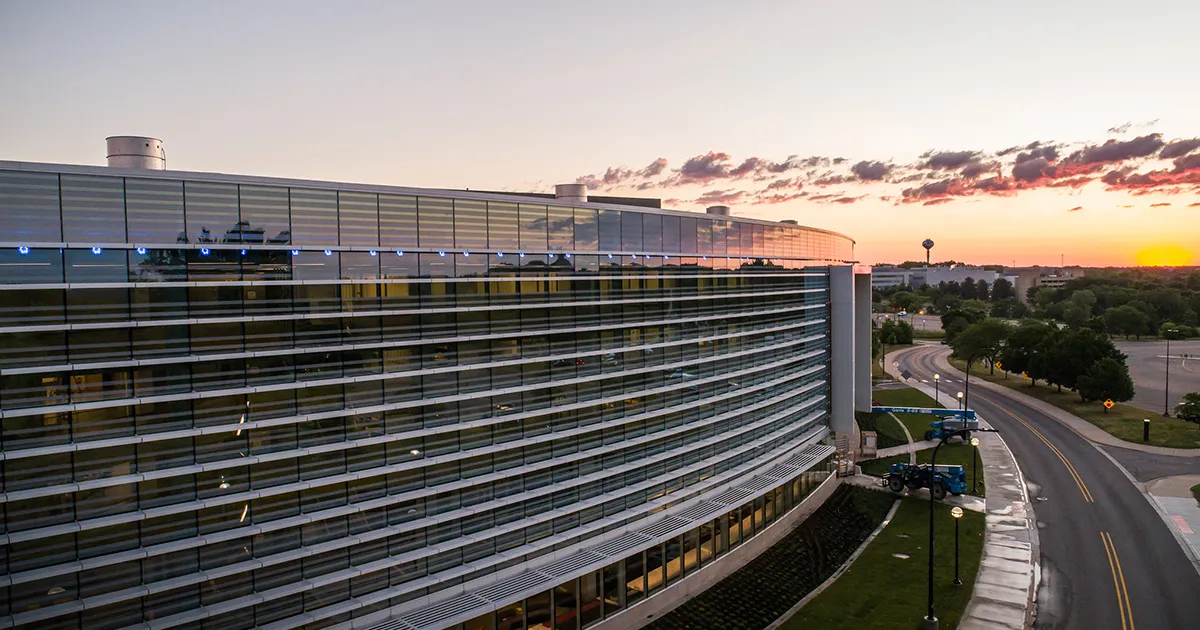 Robotics Building during sunrise with brilliant colors and a water tower in the distance