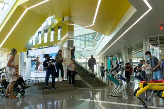 A student gives a presentation to a group of children.