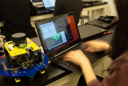 An image of someone writing code for a robot