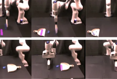 A robot sweeps up debris into a dustpan.