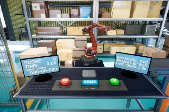 A simulated warehouse environment shows a red robotic arm picking boxes from shelves above a control console with a serial-number display, score and timer monitors, and red, blue, and green buttons used by a human operator.
