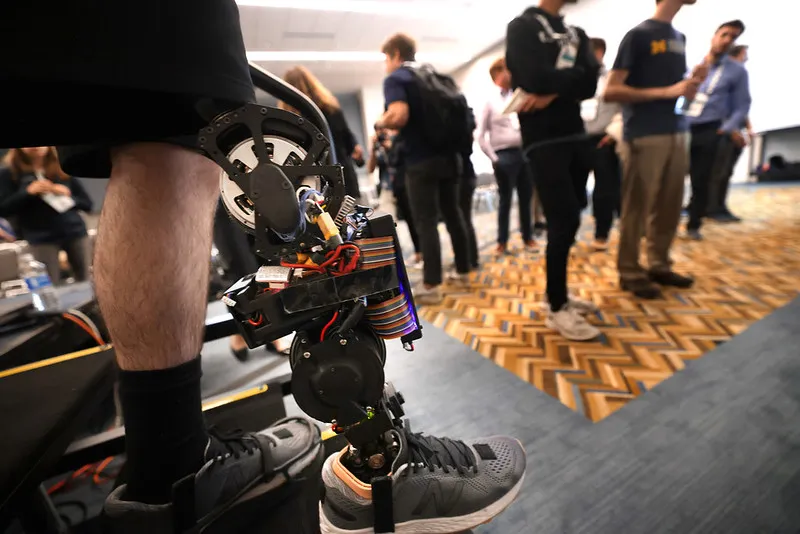 A robotic knee prosthetic is displayed at an international conference