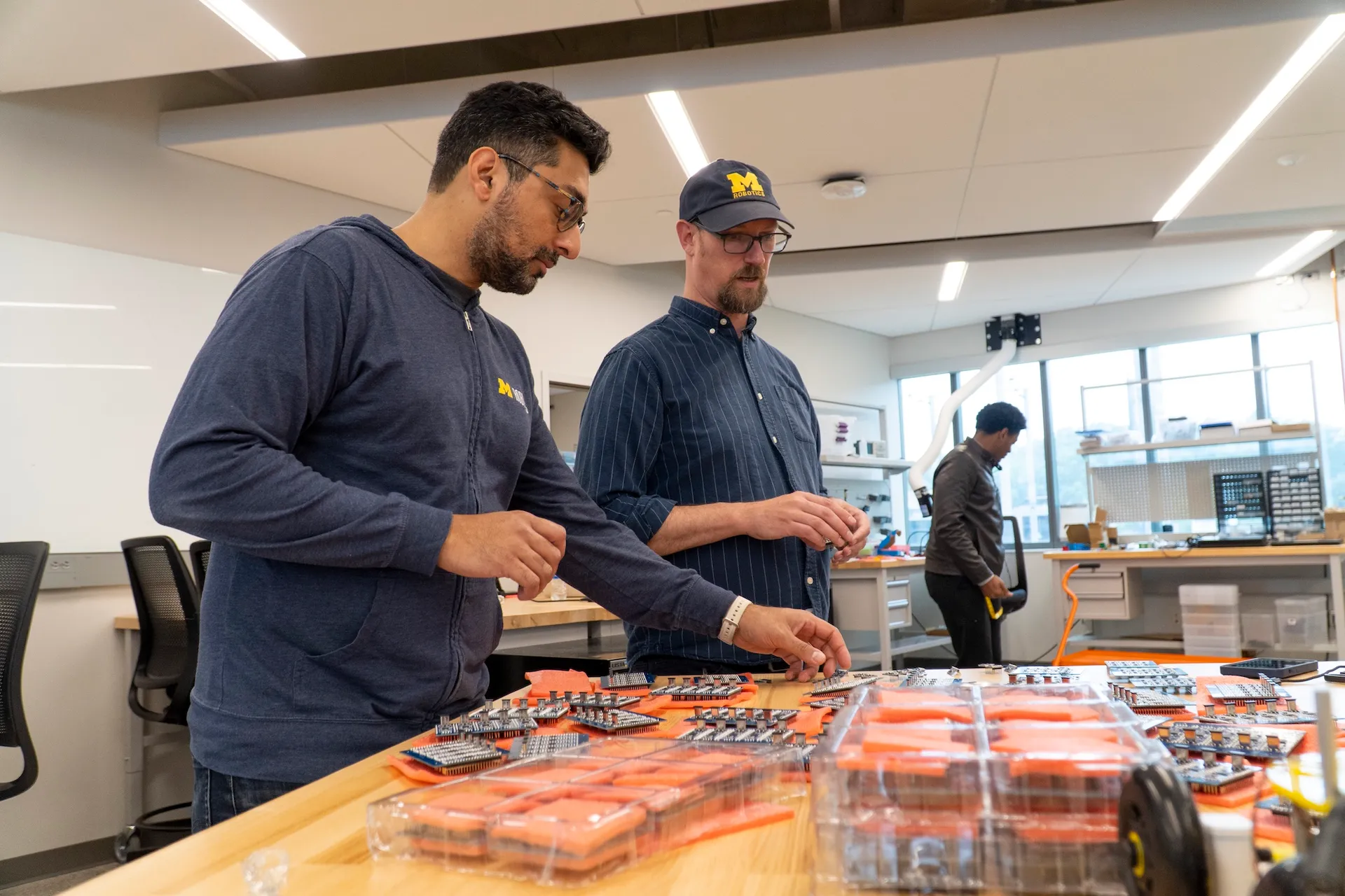 MBot components scattered on a table before assembly.