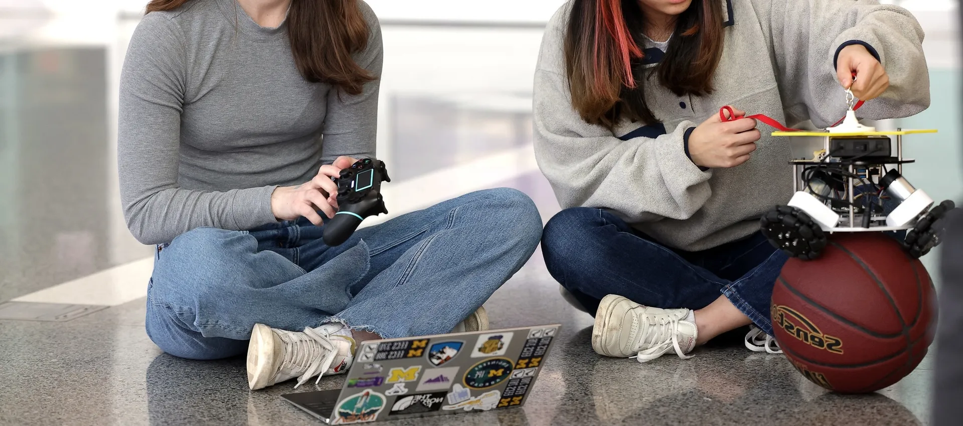 A ballbot balances on a basketball in ROB 311.