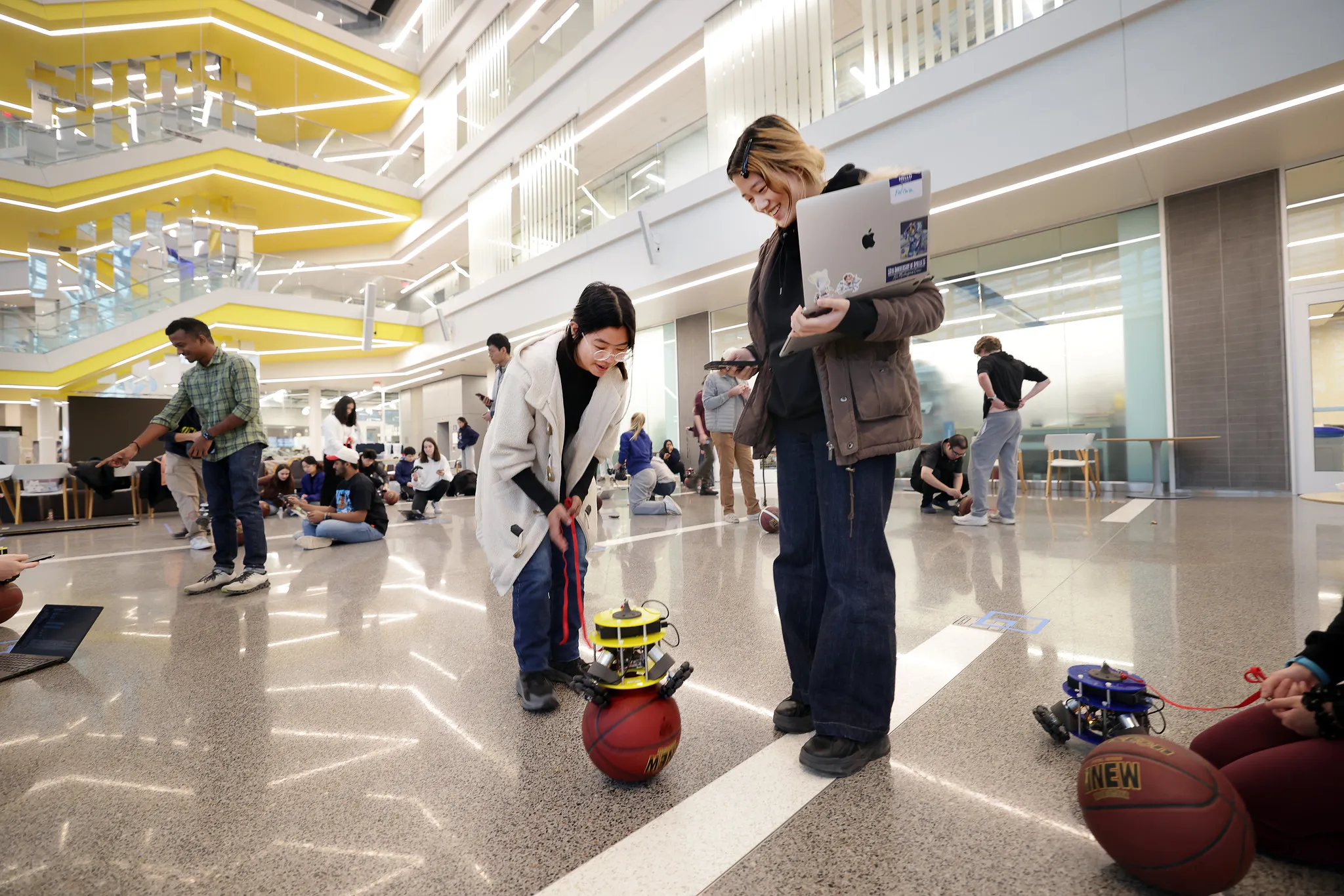 Undergraduate robotics students working in lab