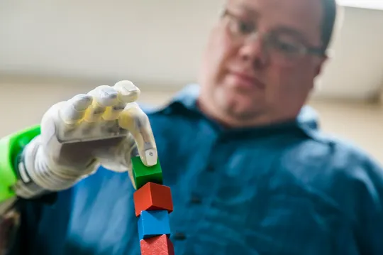 A man using a prosthetic arm.