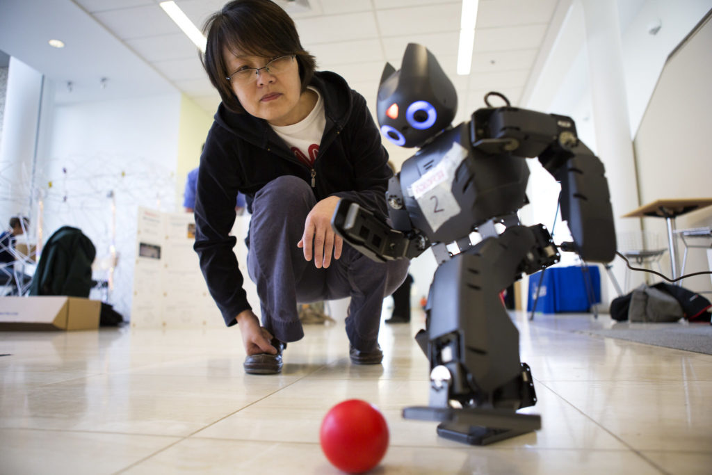Robot plays soccer